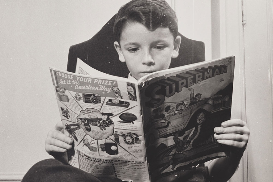 boy reading superman