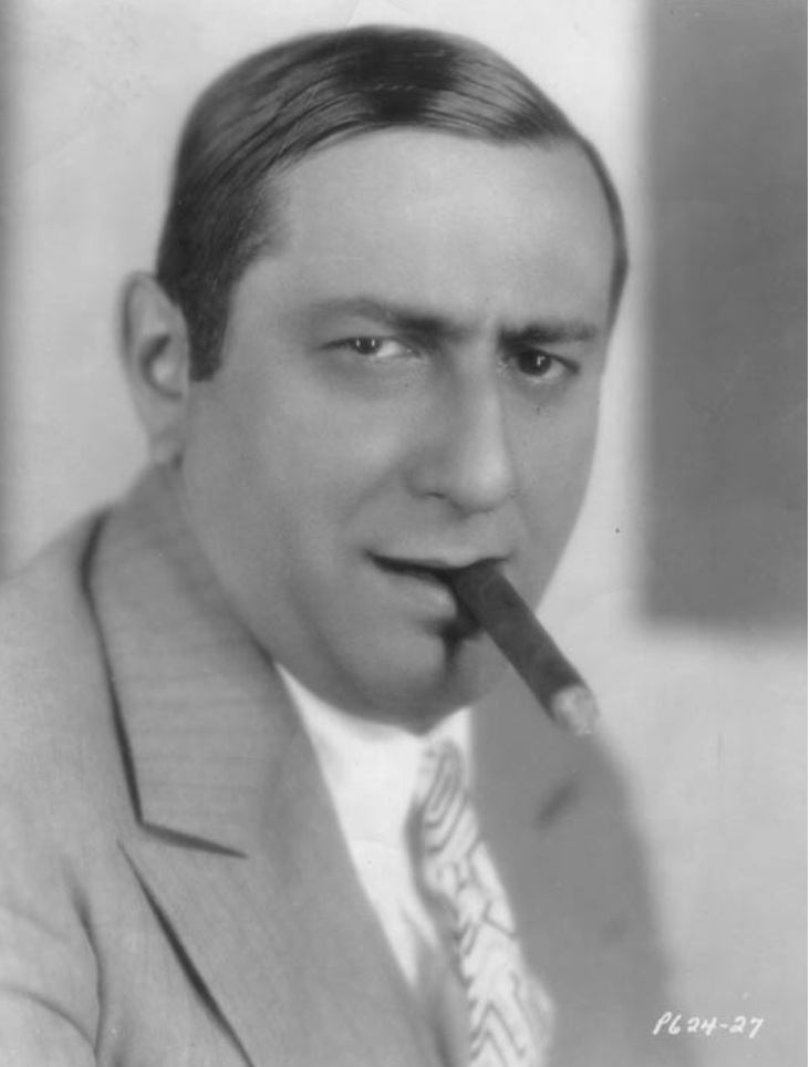 Ernst Lubitsch smoking a cigar